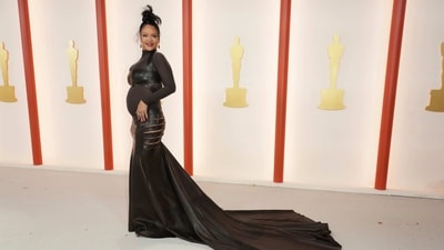 Rihanna made a stunning entrance at the Oscars ceremony in a black leather ensemble designed by Maison Alaia. She also displayed her baby bump in the sheer ensemble featuring cut-out details. (Jordan Strauss/Invision/AP) Rihanna made a stunning entrance at the Oscars ceremony in a black leather ensemble designed by Maison Alaia. She also displayed her baby bump in the sheer ensemble featuring cut-out details. (Jordan Strauss/Invision/AP)