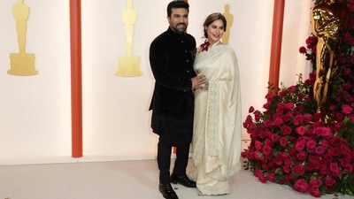 Ram Charan and his wife, Upasana Kamineni, arrive at the Oscars 2023 ceremony at the Dolby Theatre in Los Angeles. He wore a three-piece bandhgala kurta featuring a tailored jacket, asymmetric kurta and pants. (Jordan Strauss/Invision/AP) Ram Charan and his wife, Upasana Kamineni, arrive at the Oscars 2023 ceremony at the Dolby Theatre in Los Angeles. He wore a three-piece bandhgala kurta featuring a tailored jacket, asymmetric kurta and pants. (Jordan Strauss/Invision/AP)