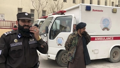 Taliban fighters stand guard outside the hospital after a bomb blast in Mazar-e Sharif, the capital city of Balkh province, in northern Afghanistan. (AP)