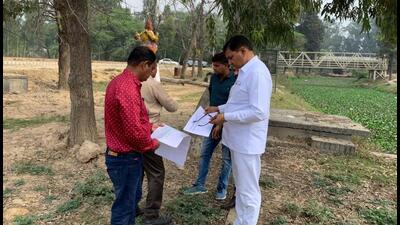 Irrigation dept officials surveying the land to be acquired for setting up a temple on Saraswati riverfront. (HT Photo) Irrigation dept officials surveying the land to be acquired for setting up a temple on Saraswati riverfront. (HT Photo)