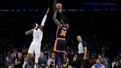 New York Knicks forward Julius Randle (30) shoots over Los Angeles Lakers forward Jarred Vanderbilt (2) during the first half of an NBA basketball game Sunday, March 12, 2023, in Los Angeles. (AP) New York Knicks forward Julius Randle (30) shoots over Los Angeles Lakers forward Jarred Vanderbilt (2) during the first half of an NBA basketball game Sunday, March 12, 2023, in Los Angeles. (AP)