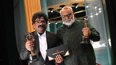Lyricist Chanrabose and Indian musical composer M.M. Keeravaani hold the Oscar for Best Music (Original Song) for their song Naatu Naatu in RRR. (AFP) Lyricist Chanrabose and Indian musical composer M.M. Keeravaani hold the Oscar for Best Music (Original Song) for their song Naatu Naatu in RRR. (AFP)