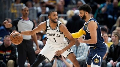 Brooklyn Nets forward Mikal Bridges, left, looks to drive to the basket as Denver Nuggets guard Jamal Murray defends in the second half of an NBA basketball game Sunday, March 12, 2023, in Denver. (AP) Brooklyn Nets forward Mikal Bridges, left, looks to drive to the basket as Denver Nuggets guard Jamal Murray defends in the second half of an NBA basketball game Sunday, March 12, 2023, in Denver. (AP)