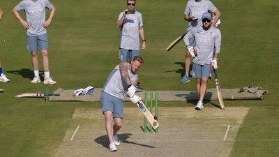 England's skipper Ben Stokes, center bottom, plays a shot as team's coach Brendon McCullum, right, and others watch during a training session, in Karachi, Pakistan, Friday, Dec. 16, 2022. (AP Photo/Fareed Khan) (AP) England's skipper Ben Stokes, center bottom, plays a shot as team's coach Brendon McCullum, right, and others watch during a training session, in Karachi, Pakistan, Friday, Dec. 16, 2022. (AP Photo/Fareed Khan) (AP)