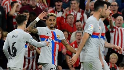 Barcelona's Raphinha, center left, celebrates after scoring his side's opening goal (AP)