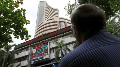 A man looks at a screen across a road displaying the Sensex on the facade of the Bombay Stock Exchange (BSE) building in Mumbai, India. (File image) (REUTERS)