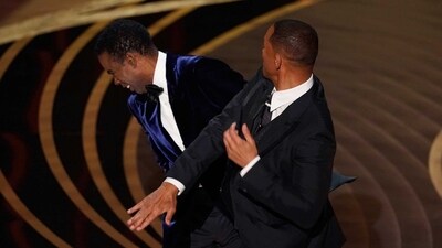 Will Smith, right, hits presenter Chris Rock on stage at the Oscars. (AP) (Chris Pizzello/Invision/AP) Will Smith, right, hits presenter Chris Rock on stage at the Oscars. (AP) (Chris Pizzello/Invision/AP)