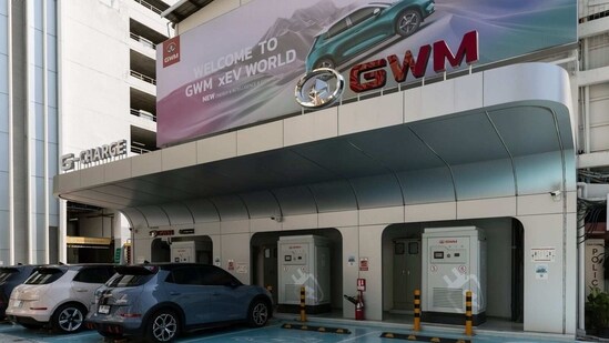 Great Wall Motor Ltd.'s Ora Good Cat electric vehicles are charged at the company's charging station at Siam Square in Bangkok, Thailand, (Bloomberg)