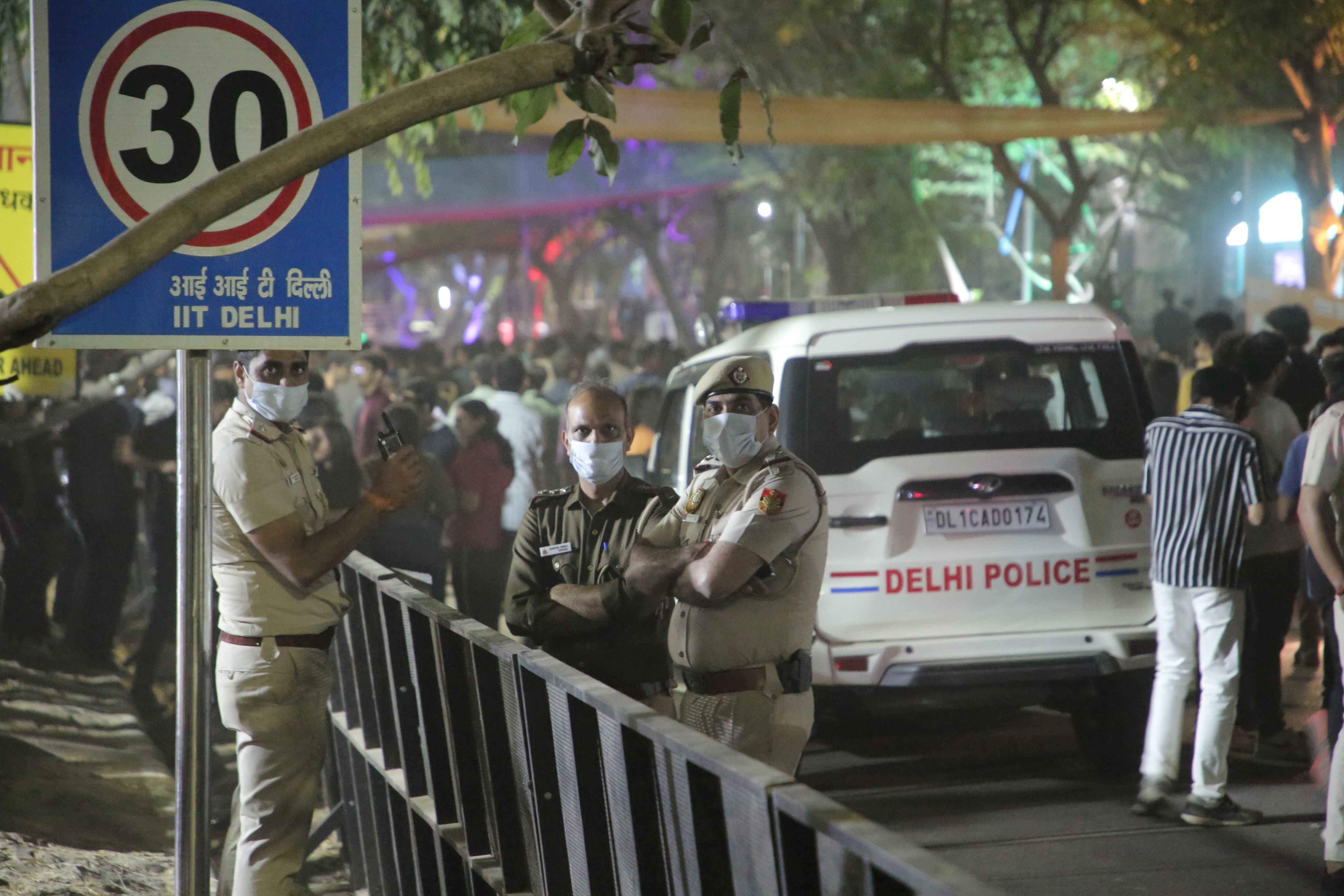 Police personnel, security guards, and bouncers cleared the crowd that had gathered to attend Guru Randhawa’s concert, after the cancellation of his gig. (Photo: Manoj Verma/HT)