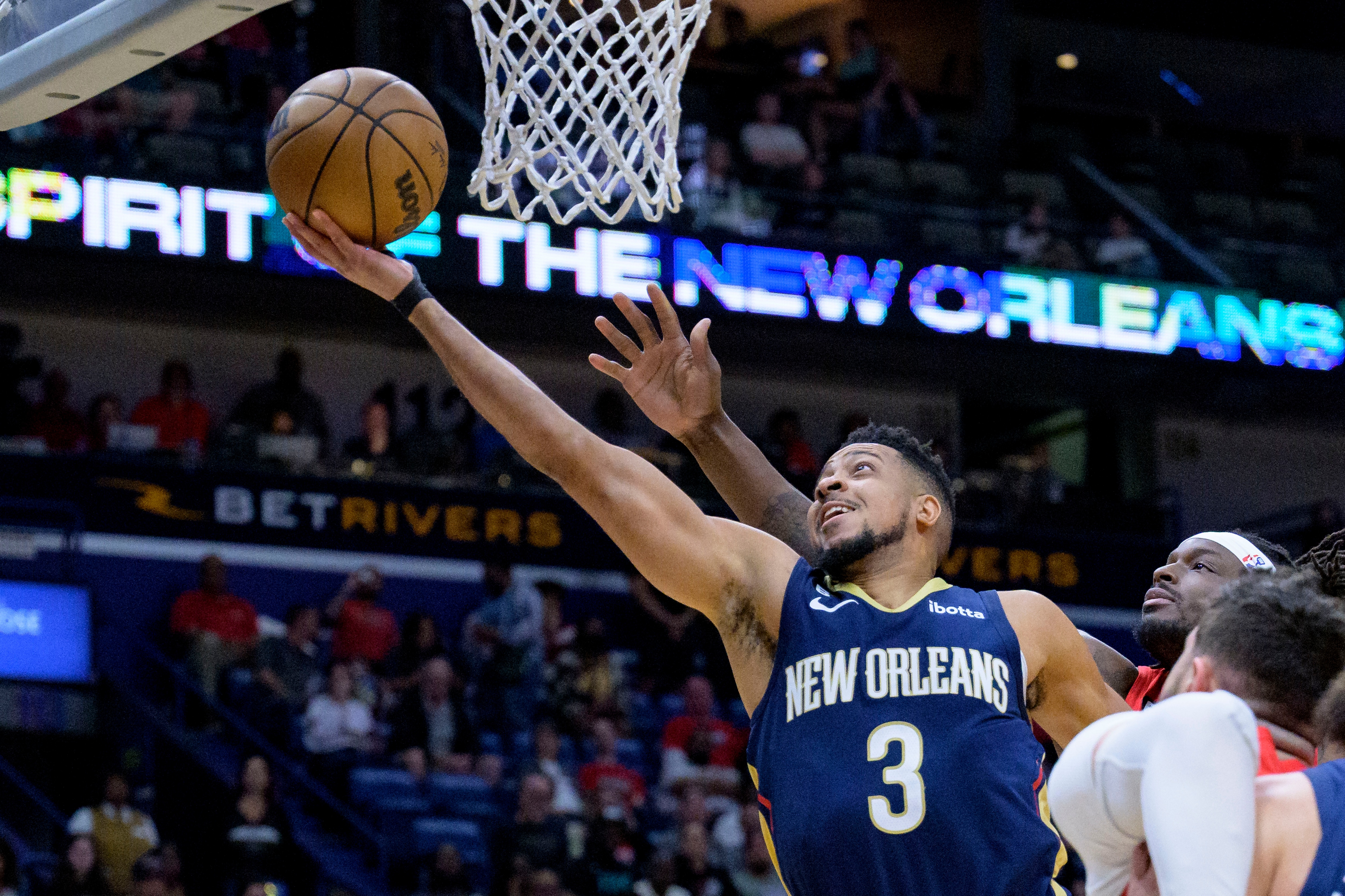 New Orleans Pelicans guard CJ McCollum (3) shoots against Portland Trail Blazers forward Jerami Grant (9) in the first half of an NBA basketball game in New Orleans, Sunday, March 12, 2023. (AP) New Orleans Pelicans guard CJ McCollum (3) shoots against Portland Trail Blazers forward Jerami Grant (9) in the first half of an NBA basketball game in New Orleans, Sunday, March 12, 2023. (AP)