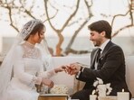 Princess Iman Wedding: The groom, Jameel Alexander Thermiotis, putting the ring on the finger of his bride, Princess Iman -- the eldest daughter of the Jordanian monarch.