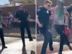The image is taken from the video that shows two US cops dancing to Naatu Naatu. The image is taken from the video that shows two US cops dancing to Naatu Naatu.