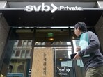 A pedestrian passes a Silicon Valley Bank Private branch in San Francisco on Monday.