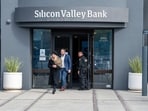 Customers exit Silicon Valley Bank headquarters in Santa Clara, California.