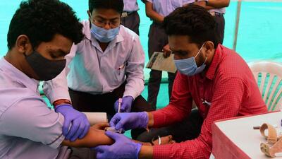 A health worker collects blood samples from a person for check-up as precaution against the H3N2 virus. (AFP Photo) A health worker collects blood samples from a person for check-up as precaution against the H3N2 virus. (AFP Photo)
