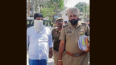 Ananad Bihari Yadav, the accused, in police custody on Tuesday. (HT Photo)