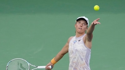 Iga Swiatek, of Poland, serves to Bianca Andreescu, of Canada, at the BNP Paribas Open tennis tournament Monday, March 13, 2023, in Indian Wells, Calif. (AP Photo/Mark J. Terrill) (AP)