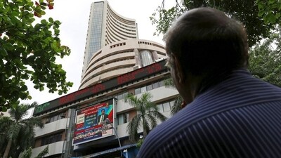 A man looks at a screen across a road displaying the Sensex on the facade of the Bombay Stock Exchange (BSE) building in Mumbai, India. (File image) (REUTERS)