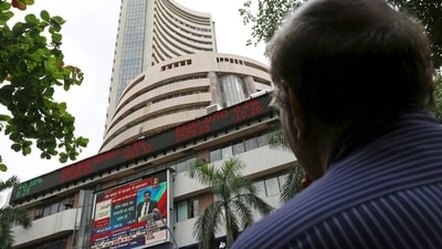 A man looks at a screen across a road displaying the Sensex on the facade of the Bombay Stock Exchange (BSE) building in Mumbai, India. (File image) (REUTERS)
