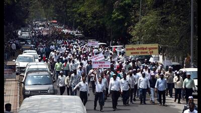 Protest by government employees at Central building, Pune station on Tuesday. (HT PHOTO) Protest by government employees at Central building, Pune station on Tuesday. (HT PHOTO)