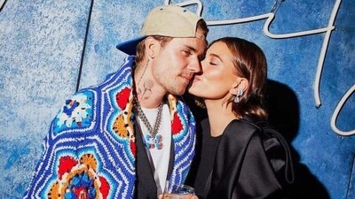 Justin wasn't quite as dressed up as his wife, opting for a multi-coloured blanket wrapped around himself instead of a suit jacket. (instagram/justinbieber) Justin wasn't quite as dressed up as his wife, opting for a multi-coloured blanket wrapped around himself instead of a suit jacket. (instagram/justinbieber)