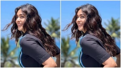 Styled by fashion stylist Sheefa J Gilani, Mrunal wore her tresses open in wavy curls with a middle part as she posed for the sun kissed pictures.&nbsp; (Instagram/@mrunalthakur)