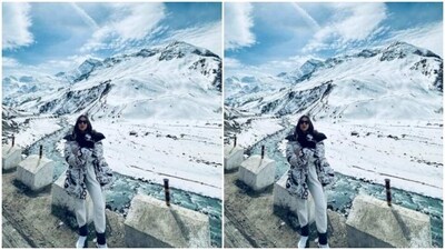 Sara looked pretty in a black turtleneck sweater and a pair of white joggers. She layered her look with a monochrome long bomber jacket featuring quirky text and patterns. (Instagram/@saraalikhan95) Sara looked pretty in a black turtleneck sweater and a pair of white joggers. She layered her look with a monochrome long bomber jacket featuring quirky text and patterns. (Instagram/@saraalikhan95)