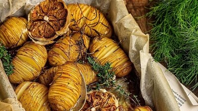 Hasselback Potatoes: Slice potatoes thinly, but not all the way through, so they stay connected at the bottom. Drizzle with olive oil, garlic, and herbs. Roast until crispy on the outside and tender on the inside. Serve with a dollop of sour cream and chives. (Unsplash) Hasselback Potatoes: Slice potatoes thinly, but not all the way through, so they stay connected at the bottom. Drizzle with olive oil, garlic, and herbs. Roast until crispy on the outside and tender on the inside. Serve with a dollop of sour cream and chives. (Unsplash)