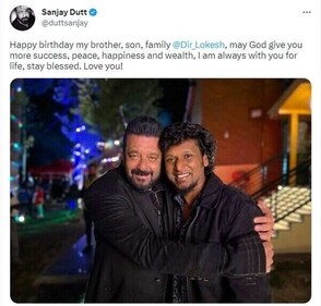 Sanjay hugged Lokesh as they smiled for the camera.