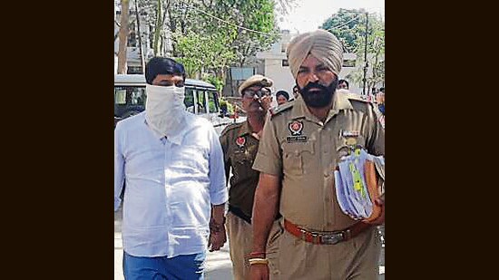 Ananad Bihari Yadav, the accused, in police custody on Tuesday. (HT Photo)