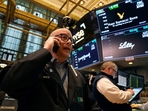 Traders work on the floor of the New York Stock Exchange.