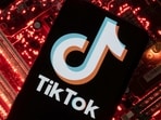 A smartphone with a displayed TikTok logo is placed on a computer motherboard in this illustration taken February 23, 2023. REUTERS/Dado Ruvic/Illustration