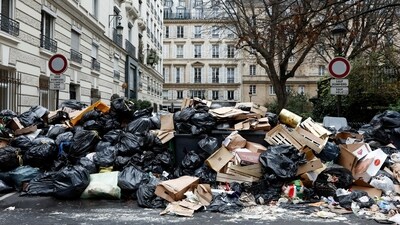 A view of a street shows overflowing garbage lying unattended as garbage collectors, street cleaners, and underground sewer workers continued their strike for the tenth day today. Strikes have intermittently hobbled other sectors including transport, energy, and ports, but Macron remains undaunted as his government presses ahead with trying to get the unpopular pension reform bill passed in parliament. The bill would raise the retirement age from 62 to 64 for most people and from 57 to 59 for most people in the sanitation sector, reported AP. (Benoit Tessier / Reuters) A view of a street shows overflowing garbage lying unattended as garbage collectors, street cleaners, and underground sewer workers continued their strike for the tenth day today. Strikes have intermittently hobbled other sectors including transport, energy, and ports, but Macron remains undaunted as his government presses ahead with trying to get the unpopular pension reform bill passed in parliament. The bill would raise the retirement age from 62 to 64 for most people and from 57 to 59 for most people in the sanitation sector, reported AP. (Benoit Tessier / Reuters)