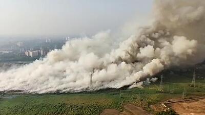 A massive fire at the Brahmapuram solid waste dump yard in Kochi, after facing criticism over the way the government handled the inferno that began on March 2 and lasted for 11 days engulfing the port city with toxic smoke and fumes. (Indian Navy) A massive fire at the Brahmapuram solid waste dump yard in Kochi, after facing criticism over the way the government handled the inferno that began on March 2 and lasted for 11 days engulfing the port city with toxic smoke and fumes. (Indian Navy)