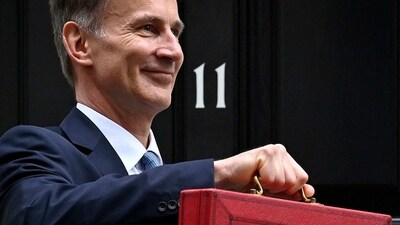 Britain's Chancellor of the Exchequer Jeremy Hunt poses with the red Budget Box as he leaves 11 Downing Street in central London on March 15, 2023, to present the government's annual budget to Parliament. (AFP) Britain's Chancellor of the Exchequer Jeremy Hunt poses with the red Budget Box as he leaves 11 Downing Street in central London on March 15, 2023, to present the government's annual budget to Parliament. (AFP)