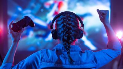 Girl in headphones plays a video game on the big TV screen. (Shutterstock/Representative Image) Girl in headphones plays a video game on the big TV screen. (Shutterstock/Representative Image)