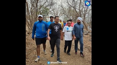 Joint commissioner of police Sandip Karnik, five zonal DCPs, 28 inspectors, 47 assistant police inspectors (API), sub-inspectors, and 222 officers conducted the morning walk patrolling on Wednesday. (HT PHOTO)