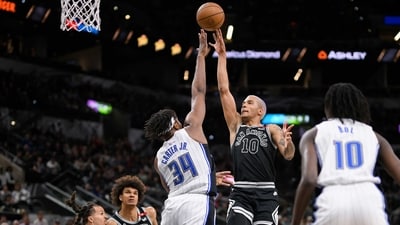 San Antonio Spurs' Jeremy Sochan (10) shoots against Orlando Magic's Wendell Carter Jr. (34) during the second half of an NBA basketball game, Tuesday, March 14, 2023, in San Antonio. San Antonio won 132-114. (AP) San Antonio Spurs' Jeremy Sochan (10) shoots against Orlando Magic's Wendell Carter Jr. (34) during the second half of an NBA basketball game, Tuesday, March 14, 2023, in San Antonio. San Antonio won 132-114. (AP)