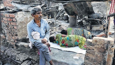 Mumbai, India - Mar 14, 2023 : Pictures from Malad's Appa Pada area where nearly 800 homes were destroyed after a Massive fire broke out on March 13, Killing 1, in Mumbai, India, on Tuesday, Mar 14, 2023.(Photo by Vijay Bate/HT Photo) Mumbai, India - Mar 14, 2023 : Pictures from Malad's Appa Pada area where nearly 800 homes were destroyed after a Massive fire broke out on March 13, Killing 1, in Mumbai, India, on Tuesday, Mar 14, 2023.(Photo by Vijay Bate/HT Photo)