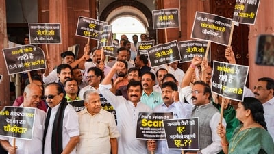 Opposition MPs march from Parliament House to Enforcement Directorate (ED) office to submit a complaint over the Adani issue, in New Delhi, Wednesday, March 15, 2023. (PTI Photo/Kamal Singh) Opposition MPs march from Parliament House to Enforcement Directorate (ED) office to submit a complaint over the Adani issue, in New Delhi, Wednesday, March 15, 2023. (PTI Photo/Kamal Singh)