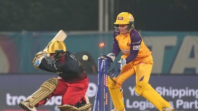 Royal Challengers Bangalore batter Kanika Ahuja is bowled out during the Women's Premier League (WPL) match against UP Warriorz (PTI) Royal Challengers Bangalore batter Kanika Ahuja is bowled out during the Women's Premier League (WPL) match against UP Warriorz (PTI)