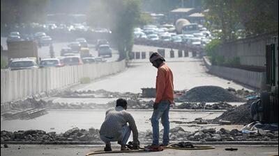 Workers repair expansion joints on the Chirag Delhi flyover on Wednesday. (Sanchit Khanna/HT Photo) Workers repair expansion joints on the Chirag Delhi flyover on Wednesday. (Sanchit Khanna/HT Photo)