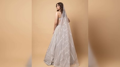 Diana Penty's outfit comprises a plunging neckline blouse, floral detailing flared lehenga and a sheer veil.&nbsp; (Instagram/@dianapenty)