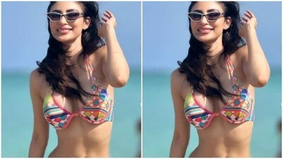 In tinted shades, Mouni wore the sun on her face as she walked through the sea waves. (Instagram/@imouniroy) In tinted shades, Mouni wore the sun on her face as she walked through the sea waves. (Instagram/@imouniroy)