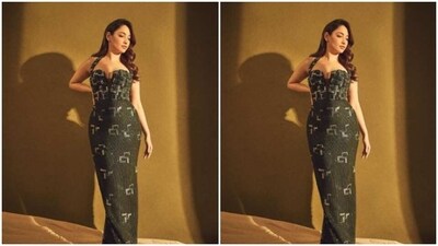 Tamannaah’s black gown came with sleeveless details, corset patterns and a plunging neckline. The gown also featured embellishment details throughout the length of the dress. The bodycon gown hugged her shape and showed off her curves perfectly.&nbsp; (Instagram/@tamannaahspeaks)