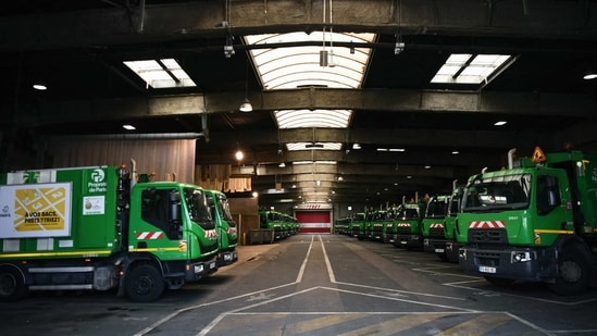 Garbage trucks are parked at an incineration plant, which is blocked by employees who are on strike to protest against the French government's proposed pensions reform in Ivry-sur-Seine, south of Paris, on March 14. Three incineration plants outside the capital have been hit by the work stoppages that have left entire pavements covered in black bags and overflowing bins, reported AFP(Christophe Archambault / AFP)