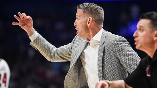 Nate Oats of the Alabama Crimson Tide signals to the court against the Texas A&M Aggies in the second half of the 2023 SEC Men's Basketball Tournament Championship game. (Getty Images via AFP)