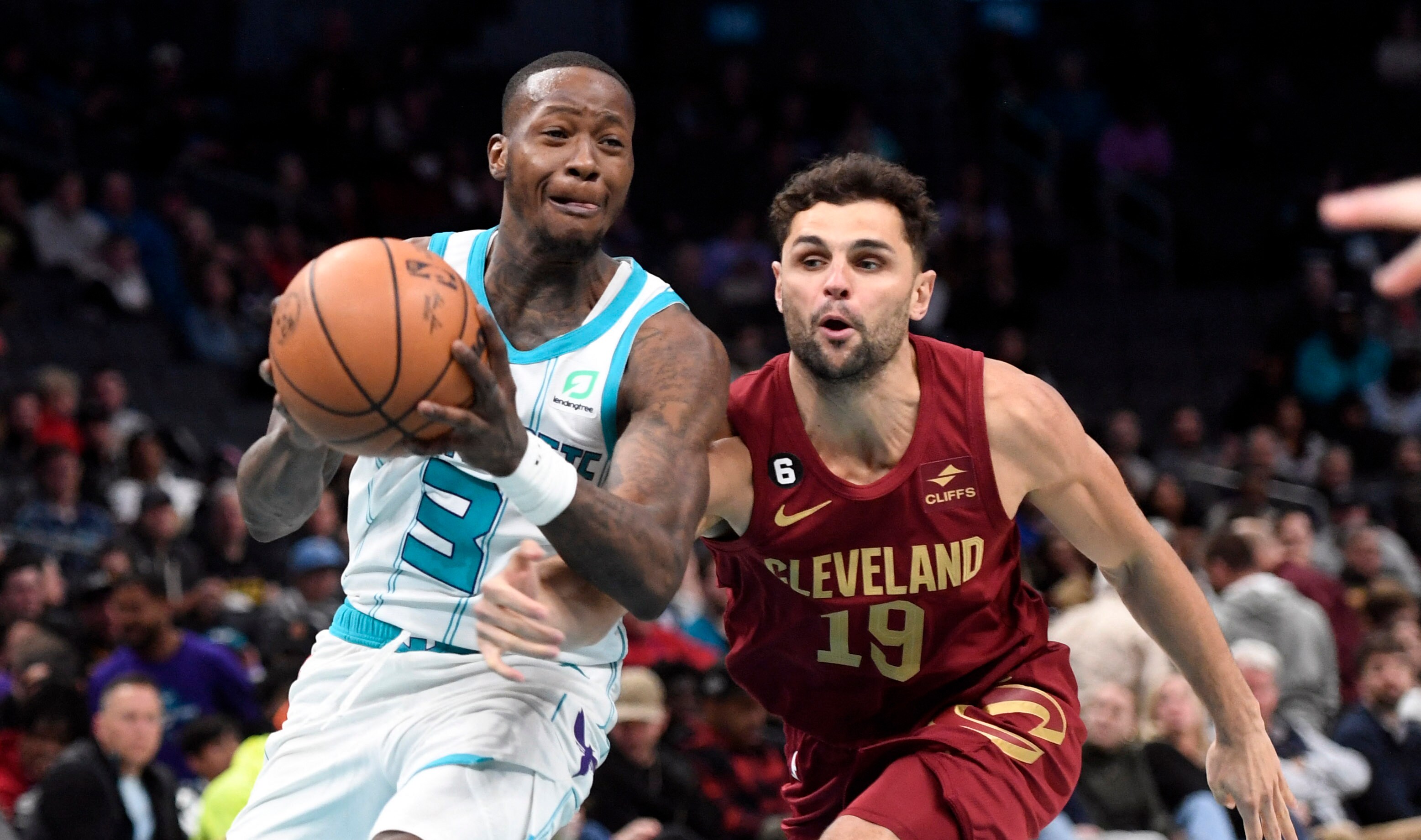 Charlotte Hornets guard Terry Rozier (3) looks to pass as he is defended by Cleveland Cavaliers guard Raul Neto (19) during the second half at the Spectrum Center. (USA TODAY Sports)