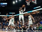 Boston Celtics forward Jaylen Brown (7) pulls down a rebound against the Minnesota Timberwolves in the second half at Target Center.