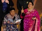 Kartiki Gonsalves, left, and Guneet Monga accept the award for best documentary short film for "The Elephant Whisperer" at the Oscars on Sunday, March 12, 2023, at the Dolby Theatre in Los Angeles. (AP Photo/Chris Pizzello)